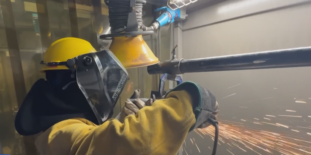 Welder Ryan Flores works on a weld at NWTC's shipbuilder training center in Marinette, Wisconsin.